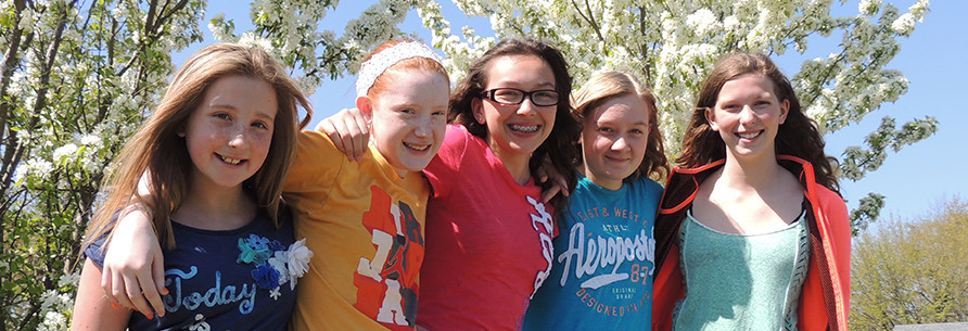 Students pose together outside